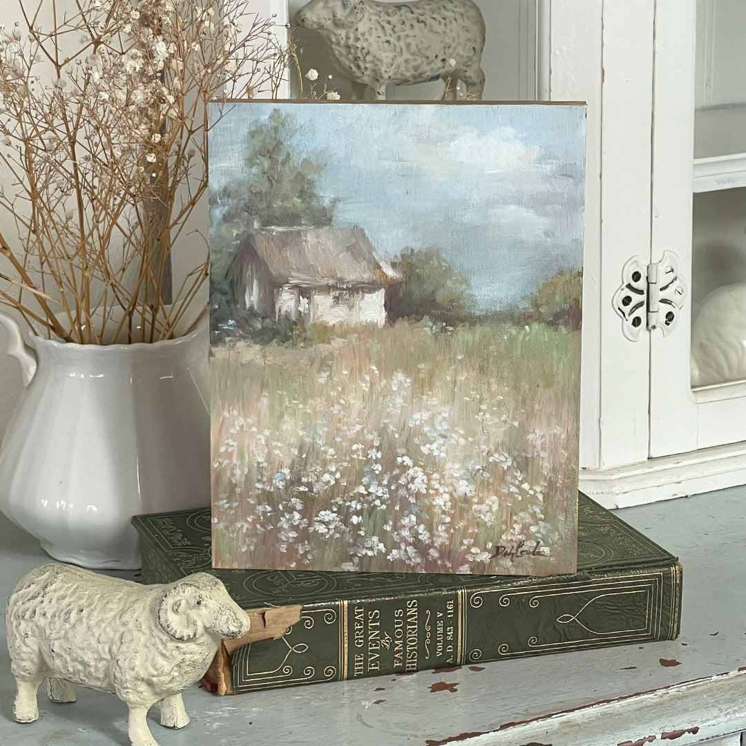 Original oil painting of a provincial English cottage surrounded by blooming wild flowers