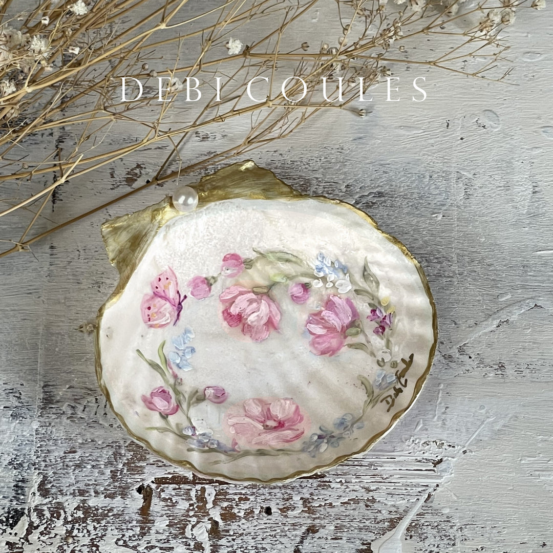 Shabby chic seashell keepsake with soft pastel wildflowers and roses