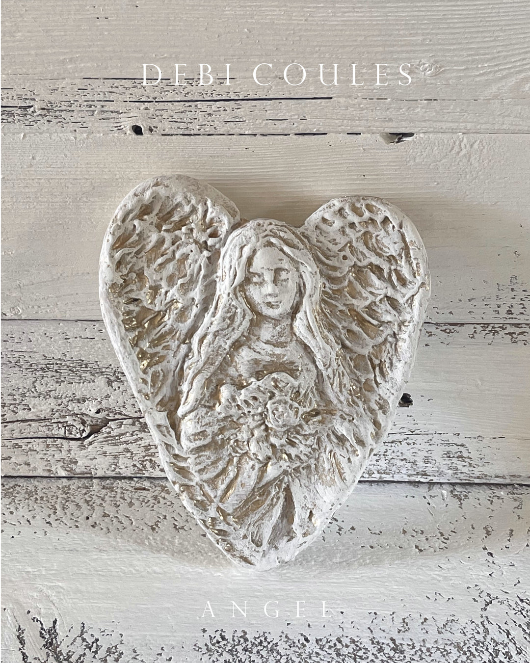 Hand carved gold  angel heart by debi coules, white with gold accents. material: plaster paris reproduction