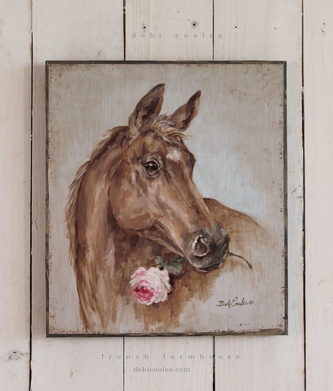 Brown horse with a white mark on it's forehead. Holding a pink rose in it's mouth. Background is a blueish green with lots of distressing around. Print on wood by Debi Coules