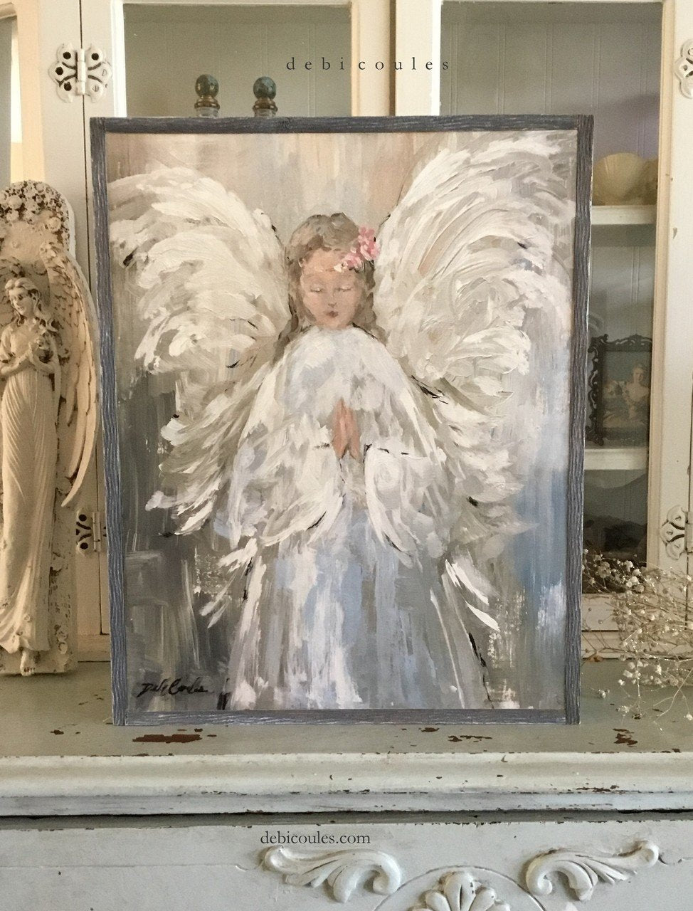 Shabby Chic angel artwork featuing an angel with her hands genlty clasped and wearing a halo of roses. Printed on wood showing natural grain and texture.
