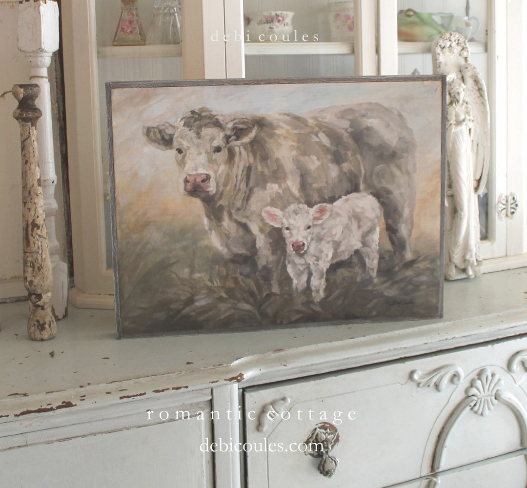 Mother and baby calf, rustic style cows standing in a pasture, Rustic Barn wood style frame. Debis love for animals is apparent with all her farmhouse collection. Also will add a touch of French Chic to your home décor.