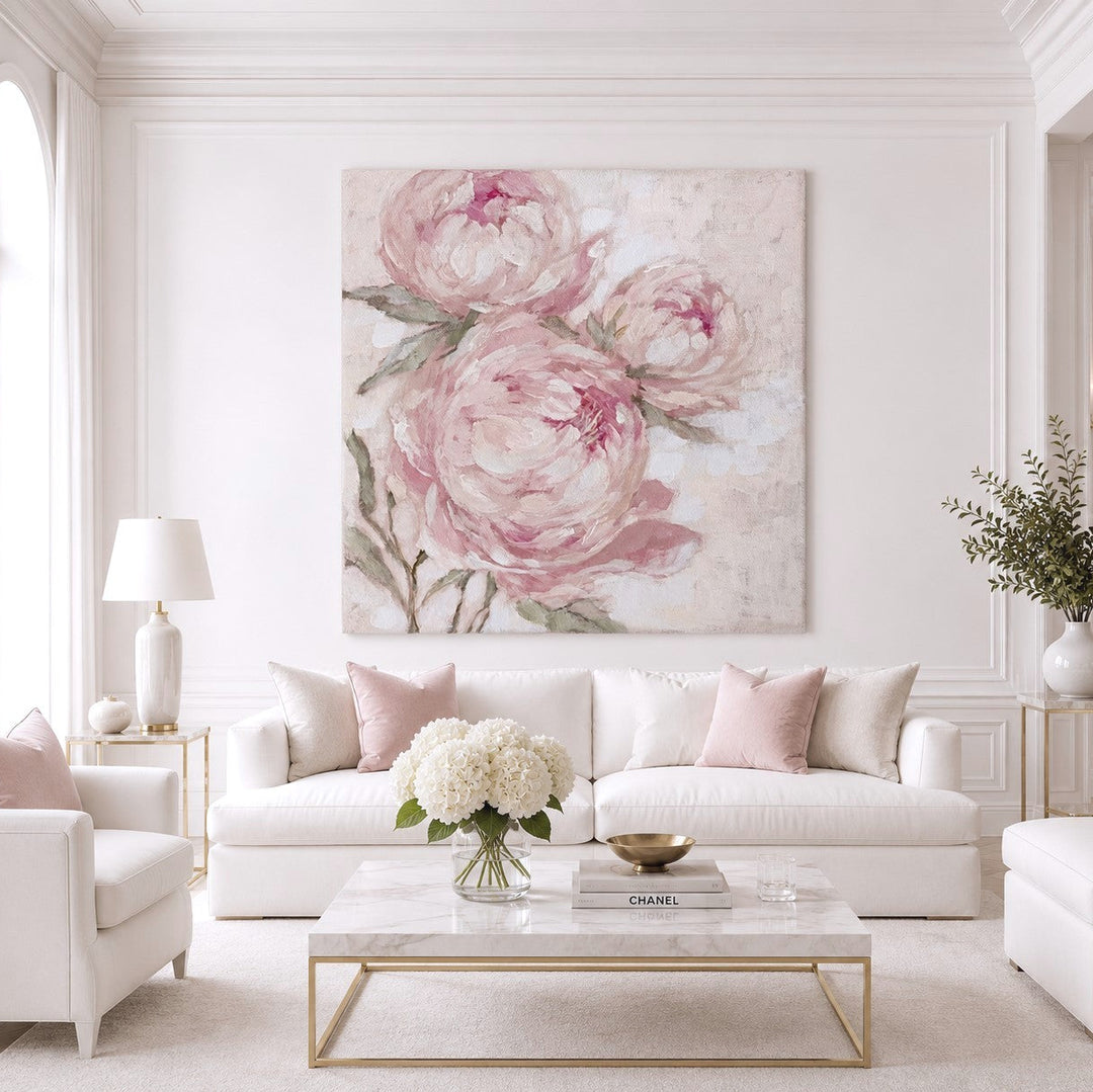 Living room with white sofa, large pink peony canvas print, and decorative elements.