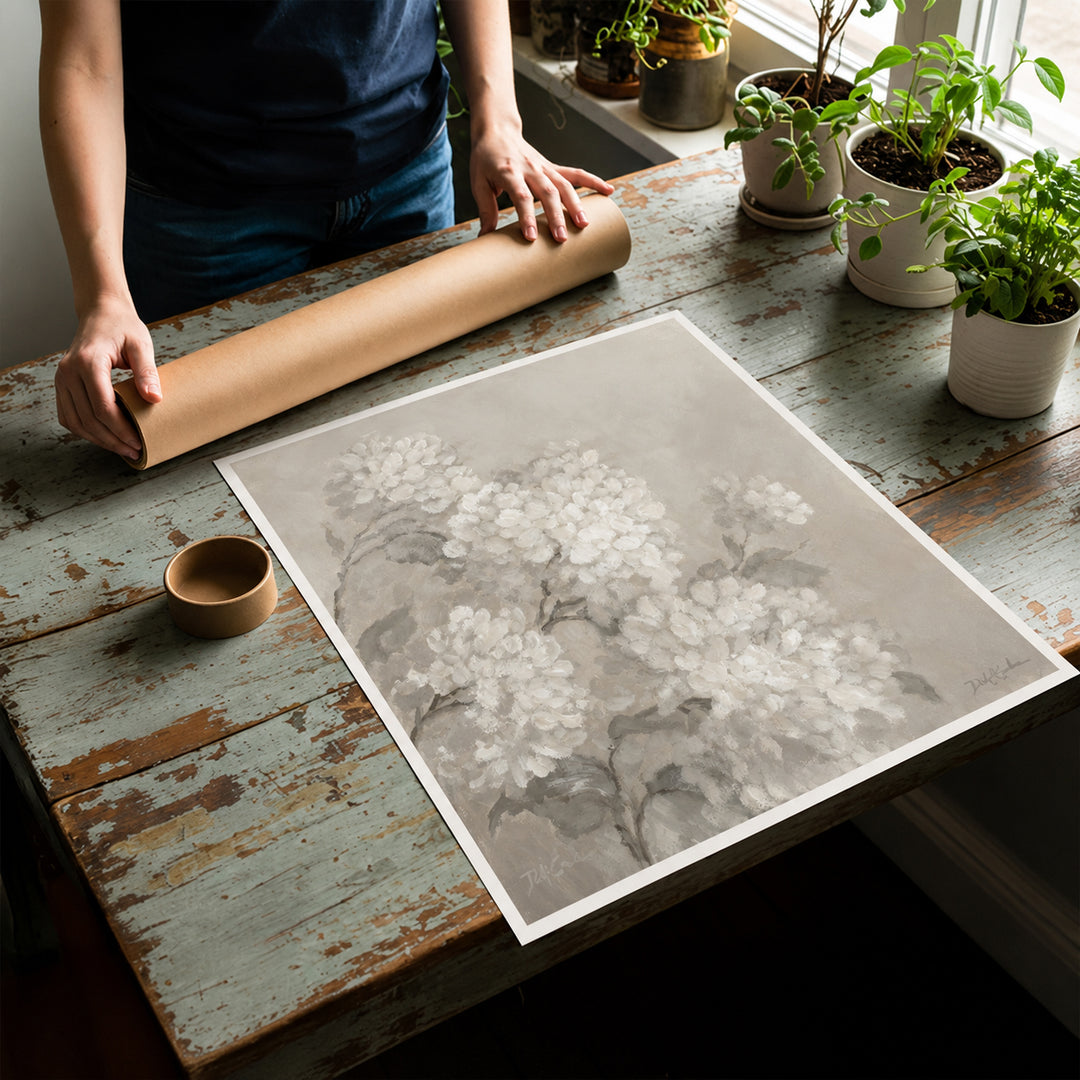 rolled canvas print flat on a table with mailing tube behind