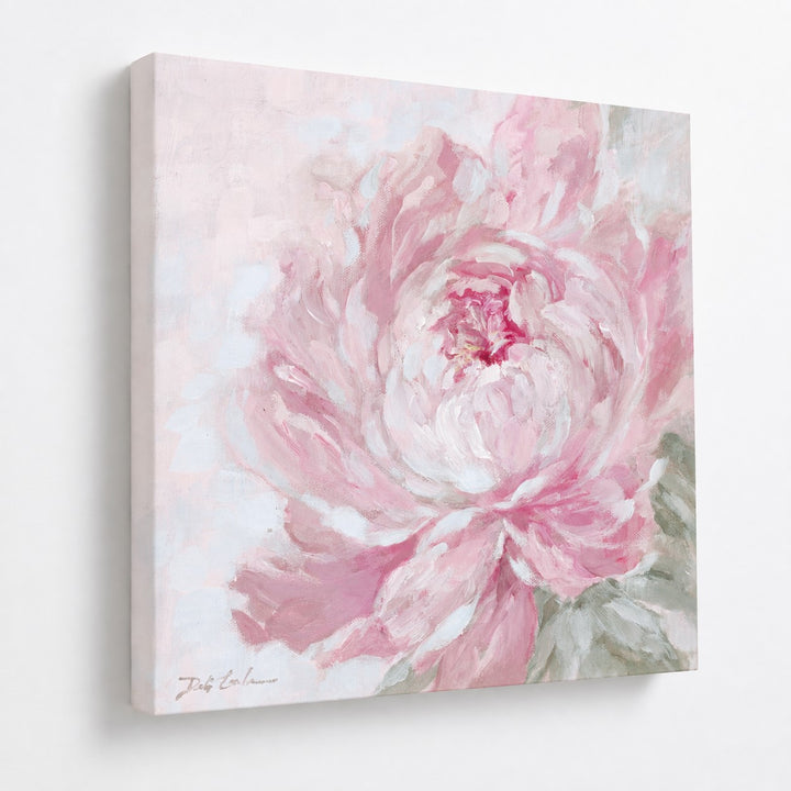 Softly Unfolding peony canvas print featuring a large painterly blush pink and white peony with muted sage green leaves, displayed at an angle on a white wall showing the 1.5-inch deep gallery-wrapped canvas.