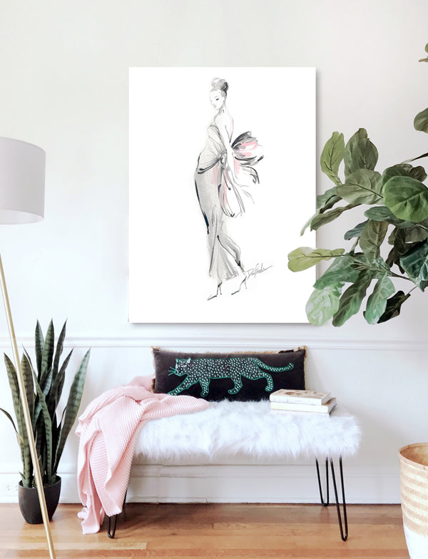 A canvas print of a French Fashion watercolor hangs in the entry of a modern interior with a faux-fur bench