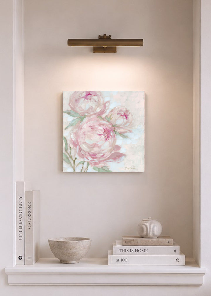 A Secret Kept in Bloom pink peony wall art displayed in a soft neutral alcove with warm lighting and elegant home décor.