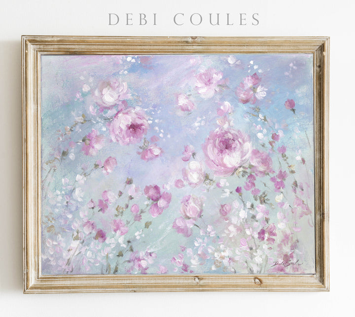 A framed Giclee paper print featuring a colorful painting of swaying pink and magenta roses on a purple/blue background with a blue sky and whispy clouds, signed by Debi Coules.