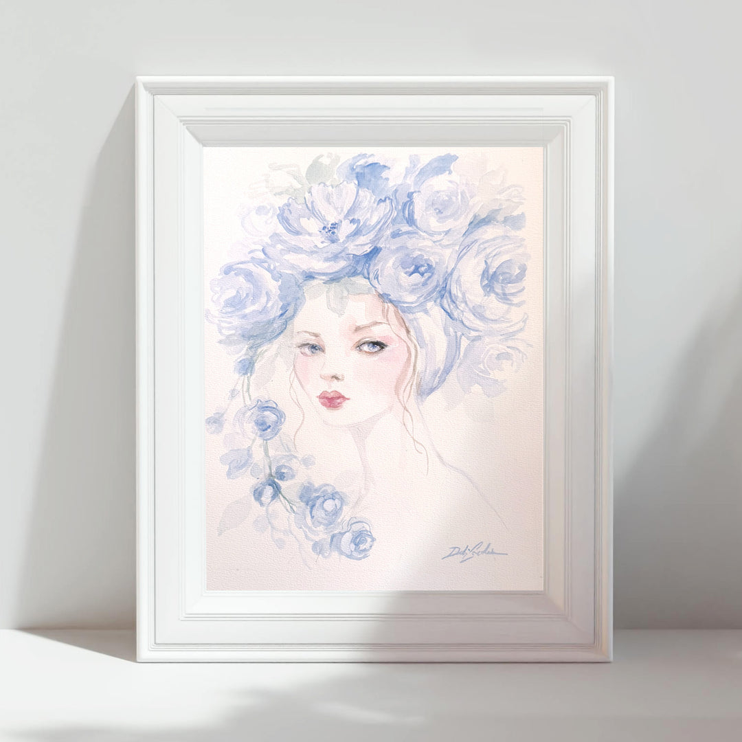 Framed watercolor artwork of a woman with blue flower fashion hat 