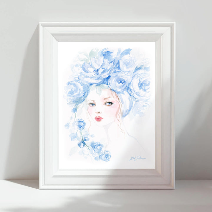Framed artwork of a woman with blue floral hair on a white background