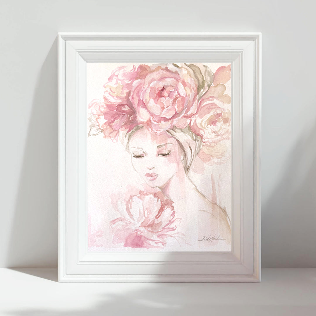 Framed artwork of a woman's face with pink floral headpiece on a white background