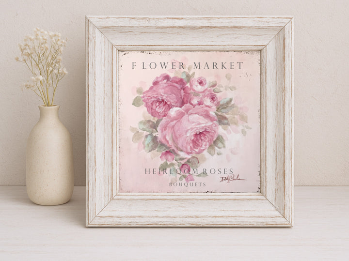 Shabby Chic cottage sign featuring pink roses in bloom framed in a beautifully distressed wooden frame painted antique white.
