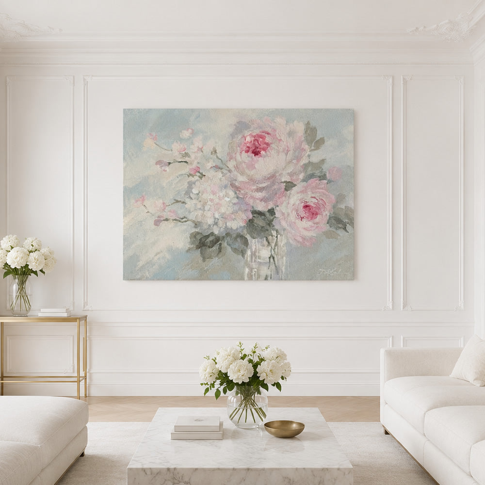 Floral bouquet canvas print on a wall in a living room with white furniture and flower vases full of white roses.