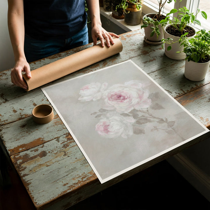 Rolled canvas print unfurled on a flat table and showing the round mailing tube behind.