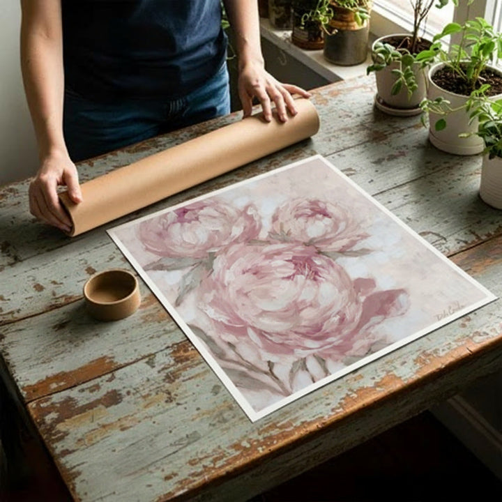 Rolled canvas print, unfurled to lay flat on a table. Mailing tube is shown behind