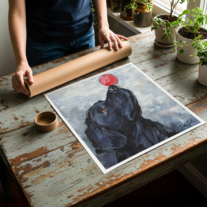 Person rolling up an unstretched canvas print of shabby chic dog artwork to be placed in a cardboard mailing tube