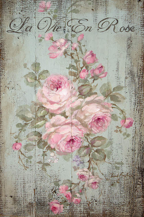 Shabby-chic decorative cottage sign with pink roses and 'La Vie En Rose' text on a natural distressed wood background