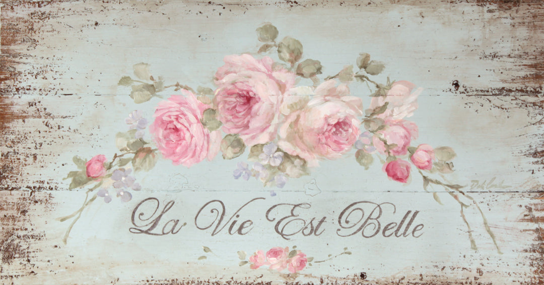 Distressed shabby-chic cottage sign with pink roses trailing across a teal background stating: la vie est belle! Life is beautiful!