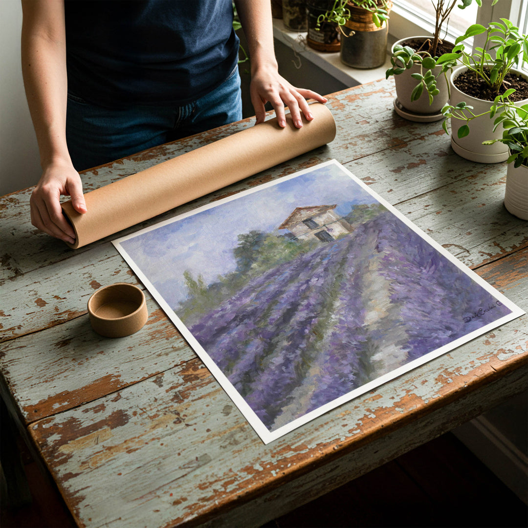 Person rolling up a fine-art paper print of shabby chic lavender artwork to be placed in a cardboard mailing tube