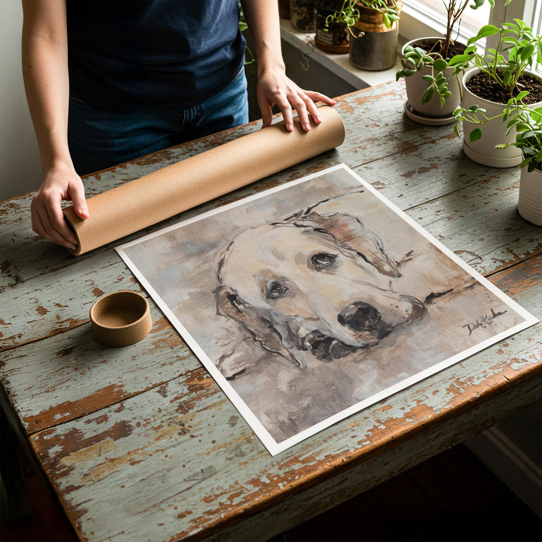 Person rolling up an unstretched canvas print of shabby chic dog artwork to be placed in a cardboard mailing tube