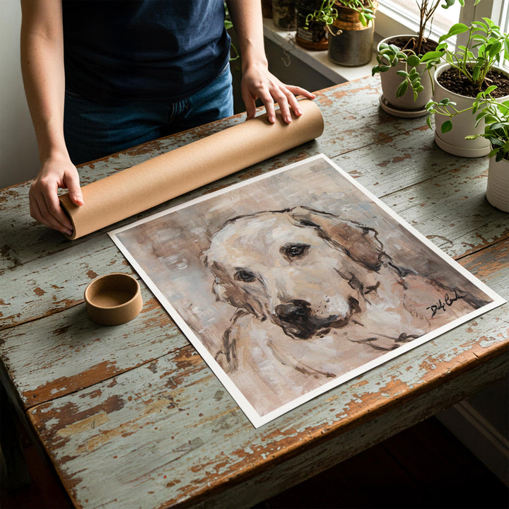 Person rolling up an unstretched canvas print of shabby chic dog artwork to be placed in a cardboard mailing tube
