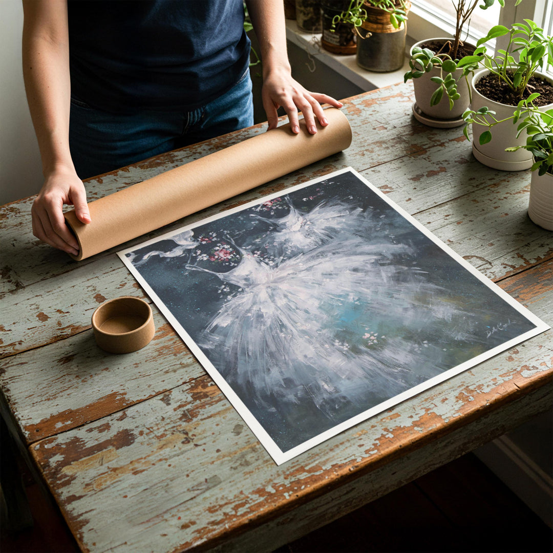 Person rolling up an unstretched canvas print of shabby chic ballet artwork to be placed in a cardboard mailing tube