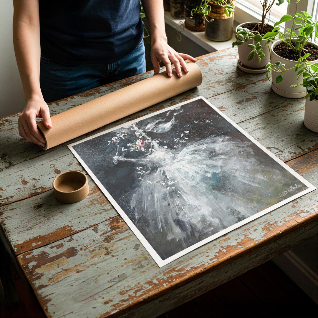 Person rolling up an unstretched canvas print of shabby chic ballet artwork to be placed in a cardboard mailing tube