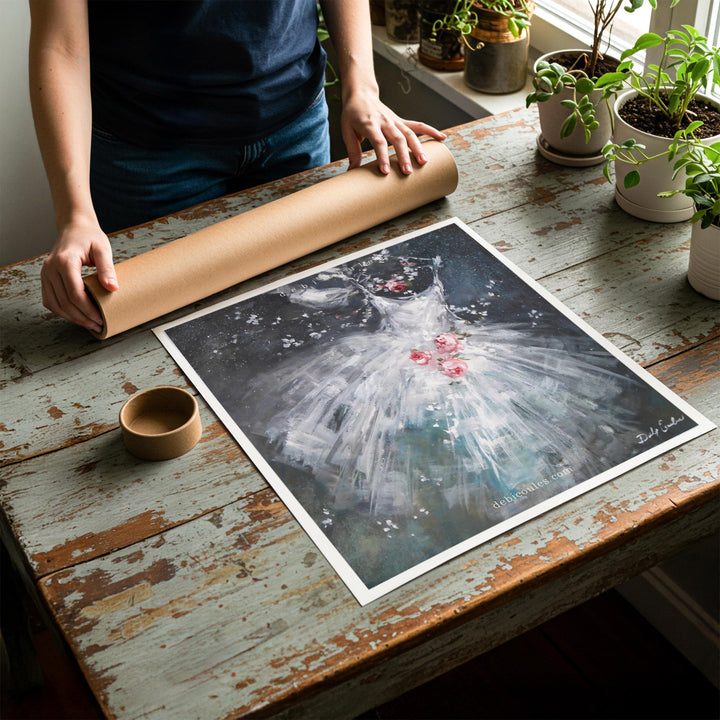 Person rolling up an unstretched canvas print of shabby chic ballet artwork to be placed in a cardboard mailing tube