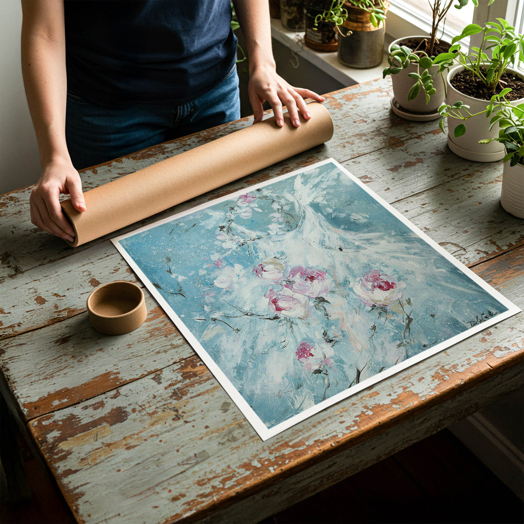 Person rolling up an unstretched canvas print of shabby chic ballet artwork to be placed in a cardboard mailing tube