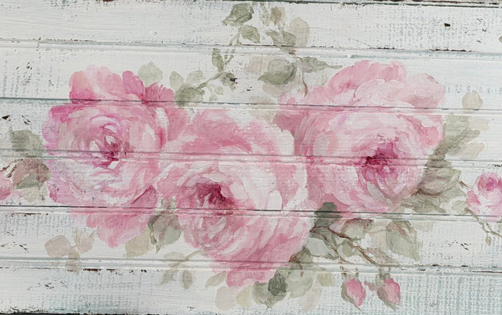 Close-up of hand-painted pink roses on an original antique beadboard by Debi Coules, highlighting the soft brushwork and distressed vintage wood.