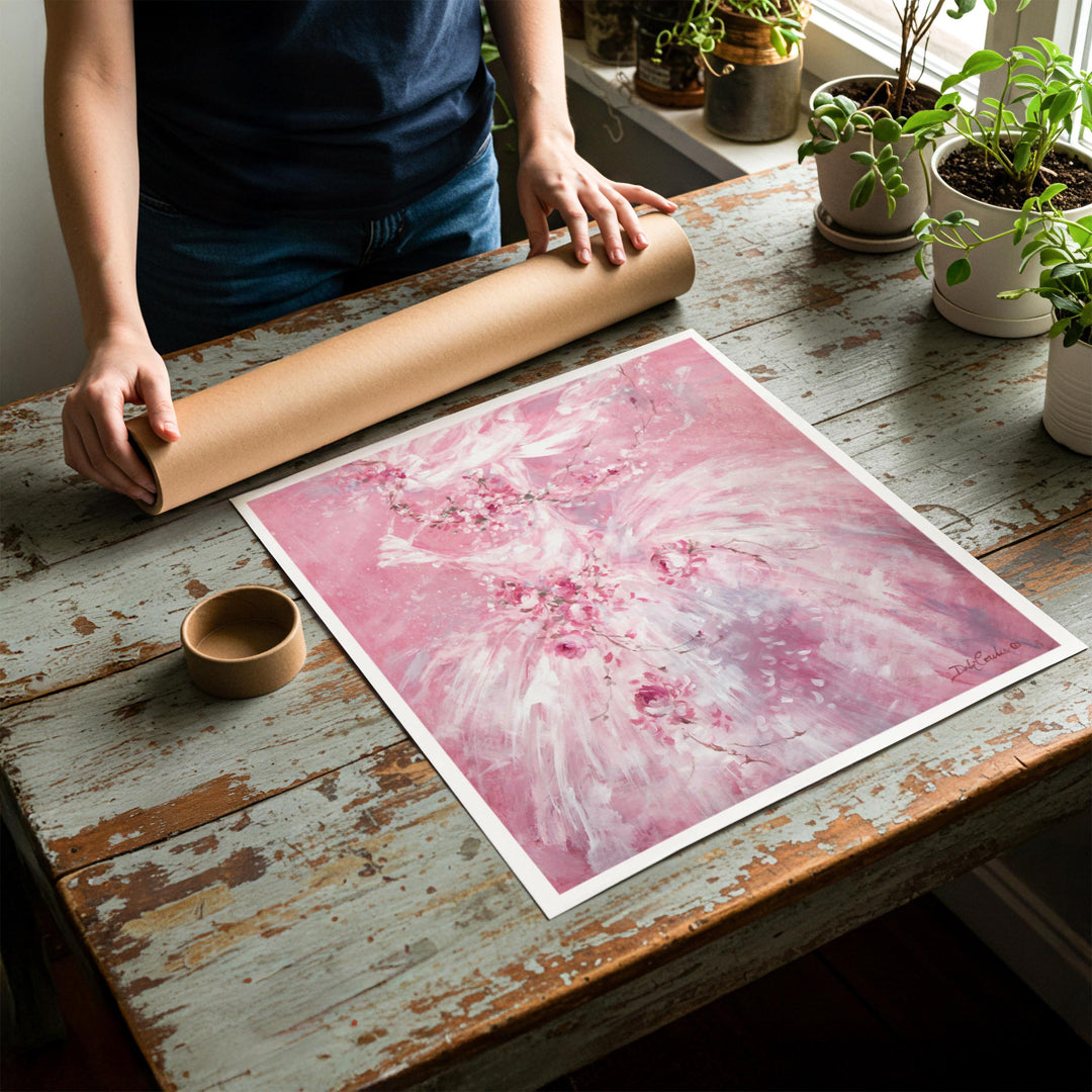 Person rolling up an unstretched canvas print of shabby chic ballet artwork to be placed in a cardboard mailing tube