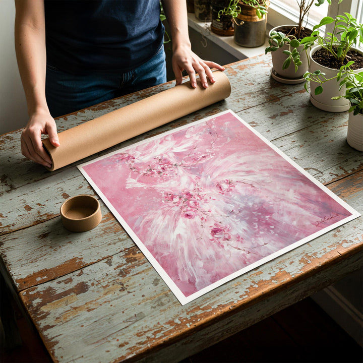 Person rolling up an unstretched canvas print of shabby chic ballet artwork to be placed in a cardboard mailing tube