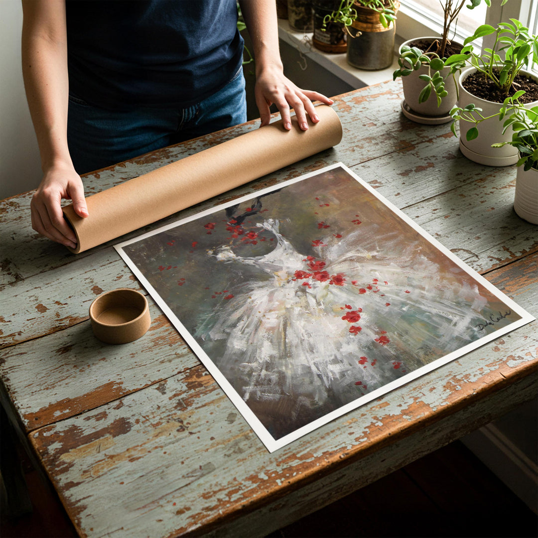 Person rolling up an unstretched canvas print of shabby chic ballet artwork to be placed in a cardboard mailing tube