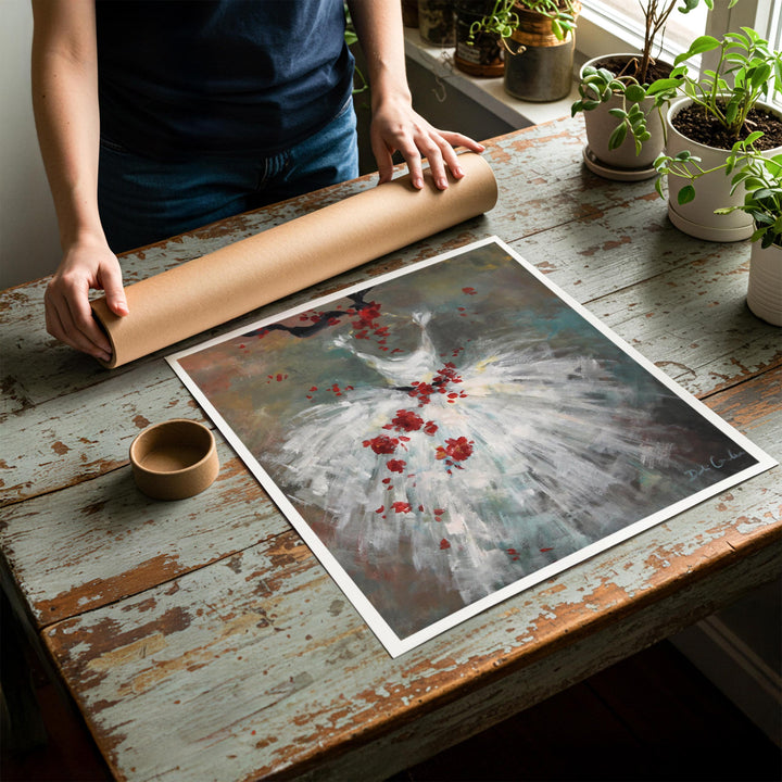 Person rolling up an unstretched canvas print of shabby chic ballet artwork to be placed in a cardboard mailing tube