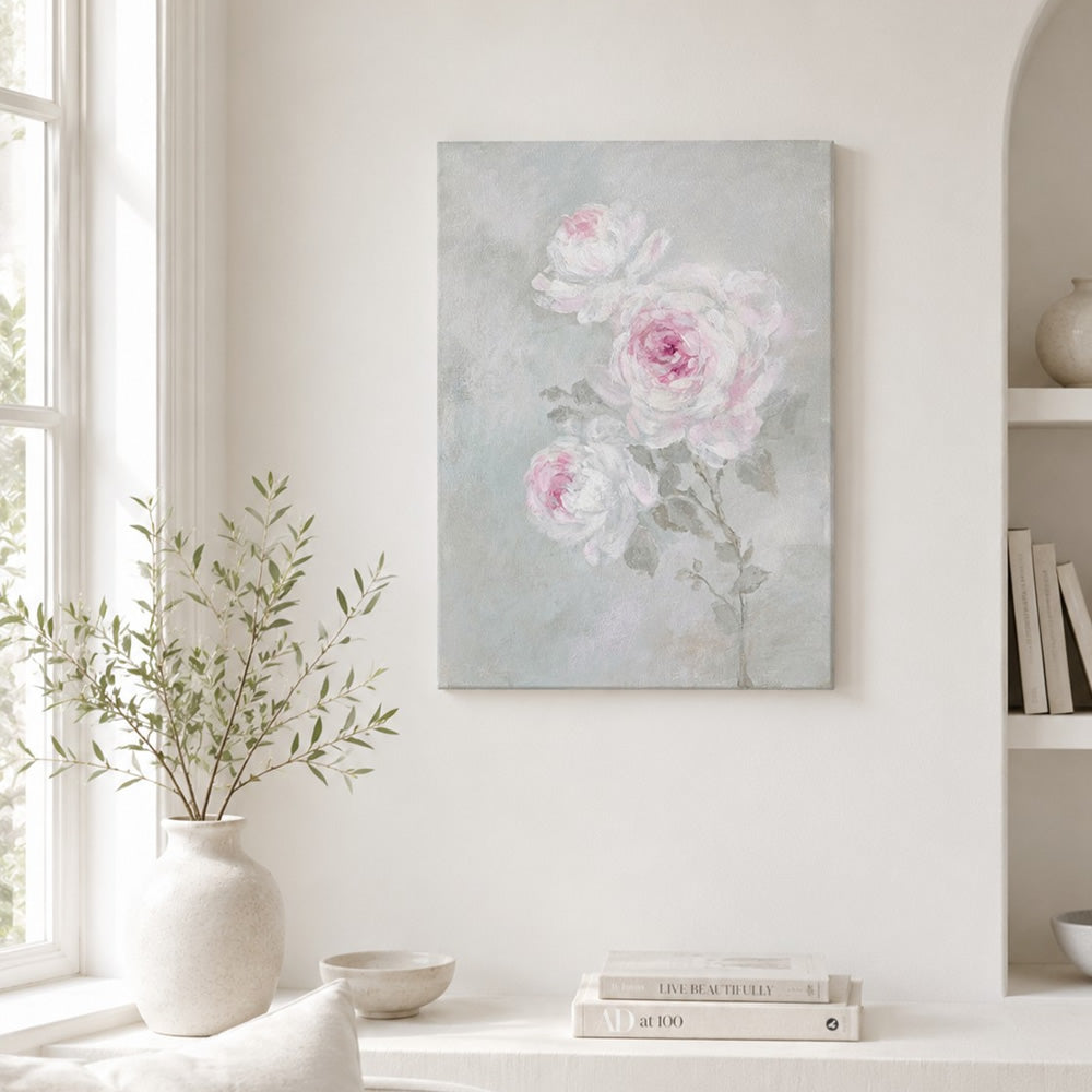 White and Pink Roses canvas print on a wall in a bright room with decor items.