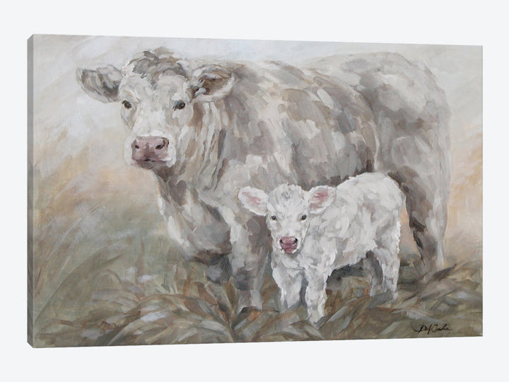 Canvas print a mother cow and a calf standing together in a field.