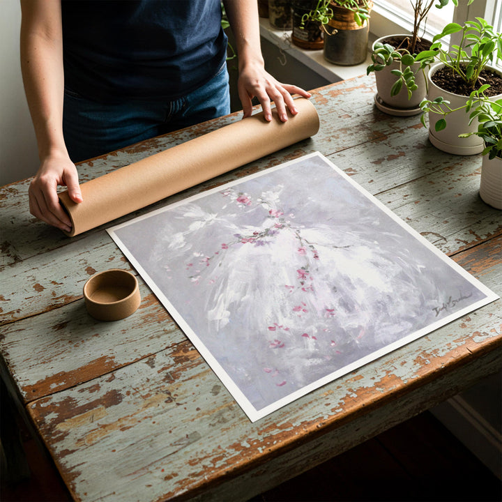 Person rolling up an unstretched canvas print of shabby chic ballet artwork to be placed in a cardboard mailing tube
