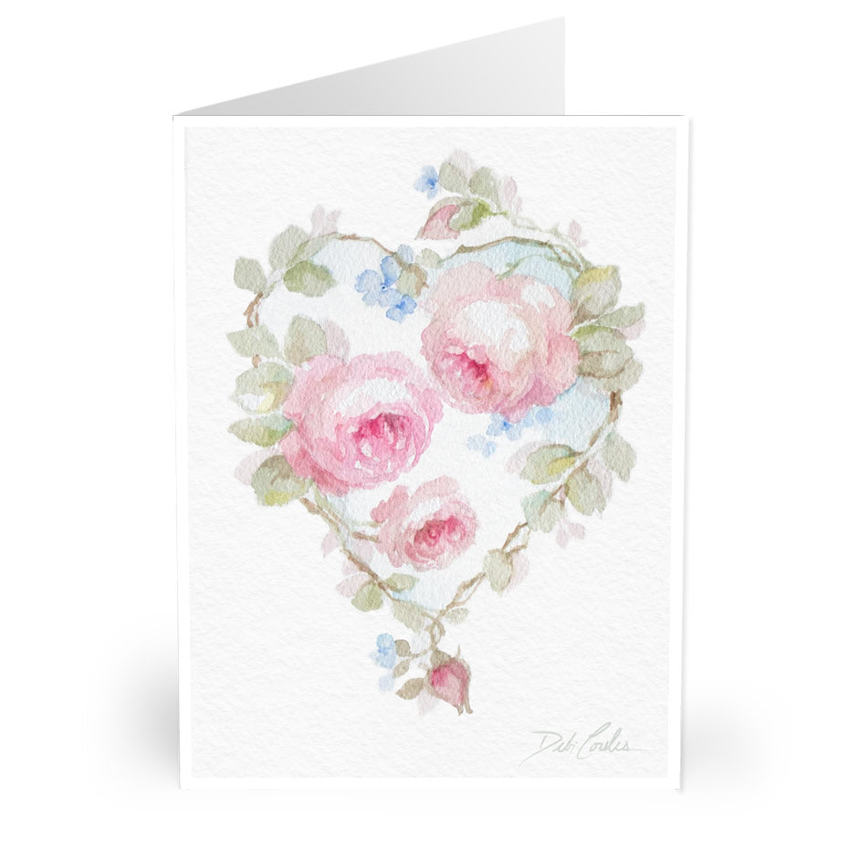 watercolor painting of roses in the shape of a heart on the cover of a valentines day card.