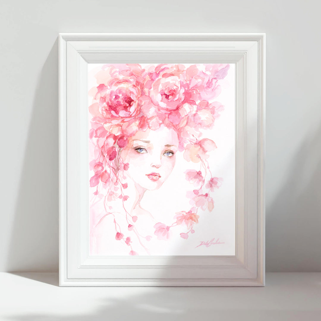 Framed paper print of a watercolor illustration of a woman's face surrounded by pink roses on a white background