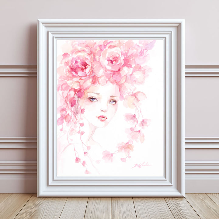 Framed paper print of a watercolor illustration of a woman's face surrounded by pink roses on a white background
