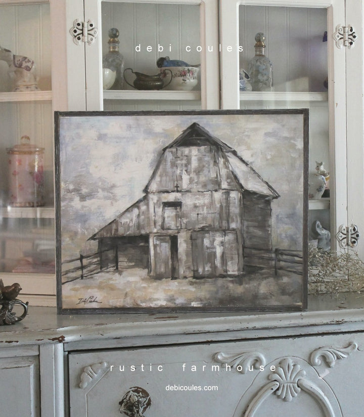 A rustic vintage barn with shades of browns, greys and black. Printed on wood and framed in 1 1/2 inch barnwood. Hay covers the ground in front. Modern farmhouse wall decor and definitely impressionist style. Would work well in Shabby Chic home too