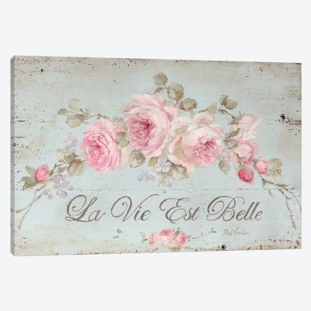 Pink roses trailing across a teal background stating, la vie est belle! Life is beautiful! in French, This Shabby chic canvas giclee print sign by Debi Coules, Pinkish white roses swag, warm colors, worn distressed look, solid wood, sawtooth hanger