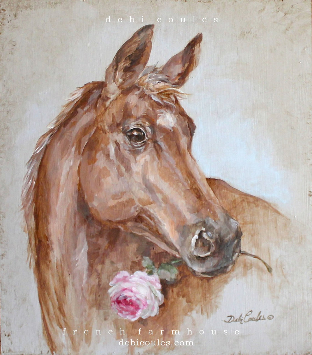 Brown horse with a white mark on it's forehead. Holding a pink rose in it's mouth. Background is a blueish green with lots of distressing around. Painted on wood by Debi Coules
