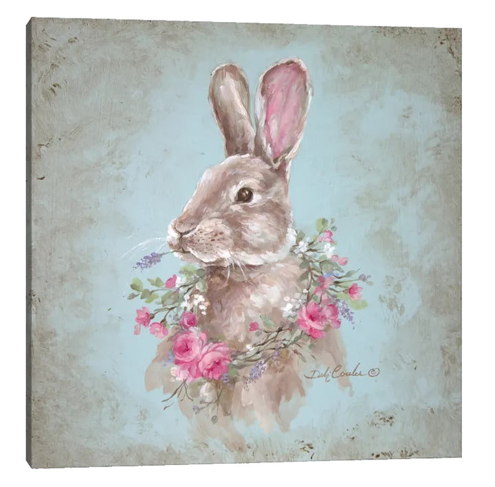 A cute Bunny with a sprige of lavender in it's mouth adorned with a wreath full of flowers. Pink Roses, purple lavender and white Babies breath all on a blueish background antiqued on all edges.